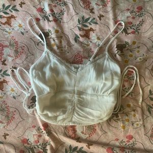 Super cute Hollister crop top with lace detailing and adjustable strings !